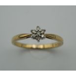 A 9 ct gold cubic zirconia paste cluster ring.