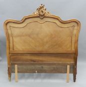 A 19th century French walnut headboard. 151 cm wide.