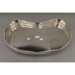 A galleried kidney shaped silver plated tray. 62 cm wide.