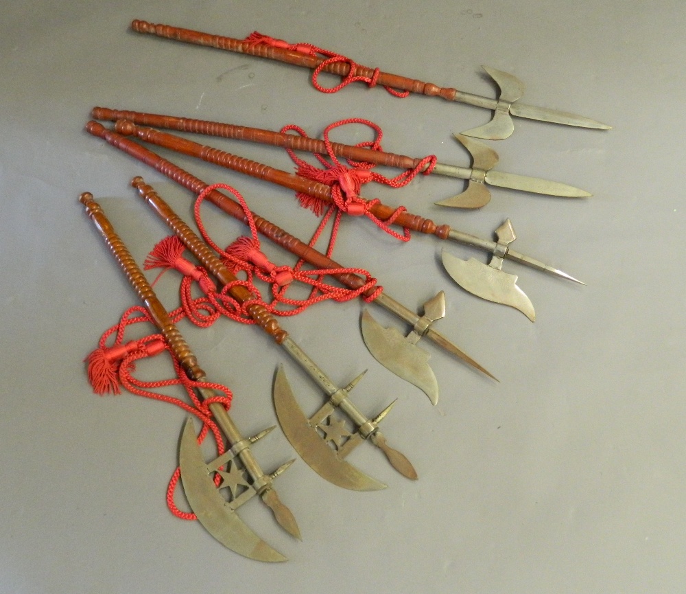 A quantity of wall hanging axes, etc. The largest 112 cm long.