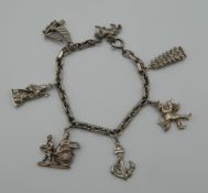 A silver charm bracelet (40 grammes).