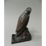A Black Forest carved wooden model of a bird of prey. 16.5 cm high.