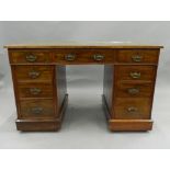 A Victorian walnut pedestal desk. 122 cm wide.