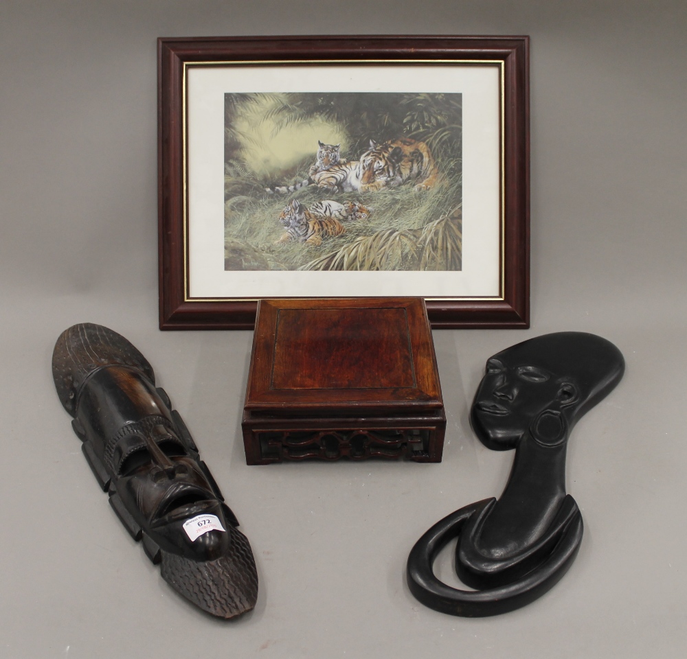 Two African wall masks, a Chinese stand and a print of tigers. The wooden figure 114 cm high.