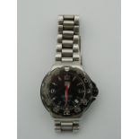 A Tag Heuer Formula 1 watch, with spare links. Serial no. WAC1210SE6338.