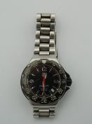 A Tag Heuer Formula 1 watch, with spare links. Serial no. WAC1210SE6338.