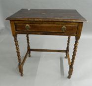 An early 20th century oak barley twist single drawer side table. 67 cm wide.