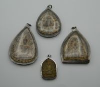 Four Eastern pendants/icons. The largest 8 cm high.