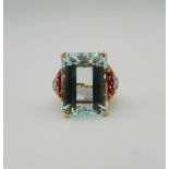 A 14 K gold aquamarine, ruby and diamond ring. Ring Size P.