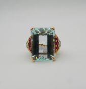 A 14 K gold aquamarine, ruby and diamond ring. Ring Size P.