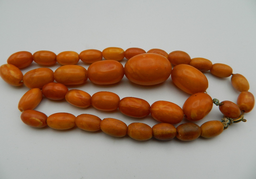 An amber bead necklace and two others. The largest 48 cm long. - Image 3 of 15