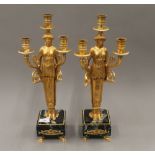 A pair of gilt figural candlesticks. 44.5 cm high.