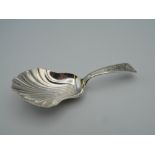 A George III silver caddy spoon. 8.5 cm long (11.