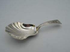 A George III silver caddy spoon. 8.5 cm long (11.