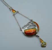 An Art Nouveau style silver enamel pendant. 4.5 cm high.