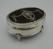 A silver and tortoiseshell trinket box. 7.5 cm wide.