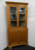 A 19th century glazed pine corner cabinet. 195 cm high.