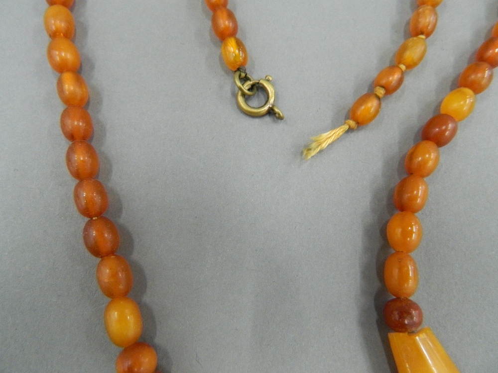 An amber bead necklace and two others. The largest 48 cm long. - Image 15 of 15