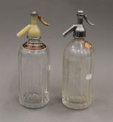 Two vintage soda syphons. The largest 30 cm high.