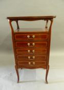 An Edwardian inlaid mahogany music cabinet. 97.5 cm high.