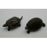 Two Japanese bronze tortoises. The largest 5 cm long.