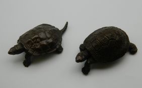 Two Japanese bronze tortoises. The largest 5 cm long.