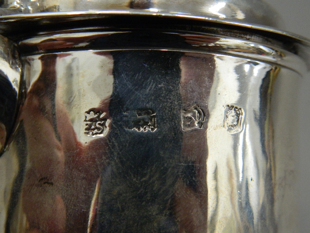 A George II silver lidded tankard, hallmarked for London 1742, maker's mark of F Spilsbury. 17. - Image 9 of 11