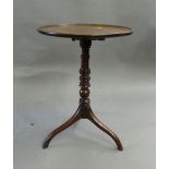 A 19th century mahogany tilt-top tripod table. 51 cm diameter.