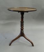 A 19th century mahogany tilt-top tripod table. 51 cm diameter.