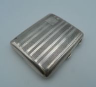 A silver cigarette case. 8.5 cm wide (78.2 grammes).