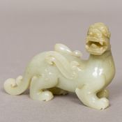 A Chinese jade carving, formed as a dragon. 10 cm long.