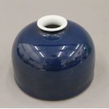 A Chinese blue porcelain brush pot. 8 cm high.