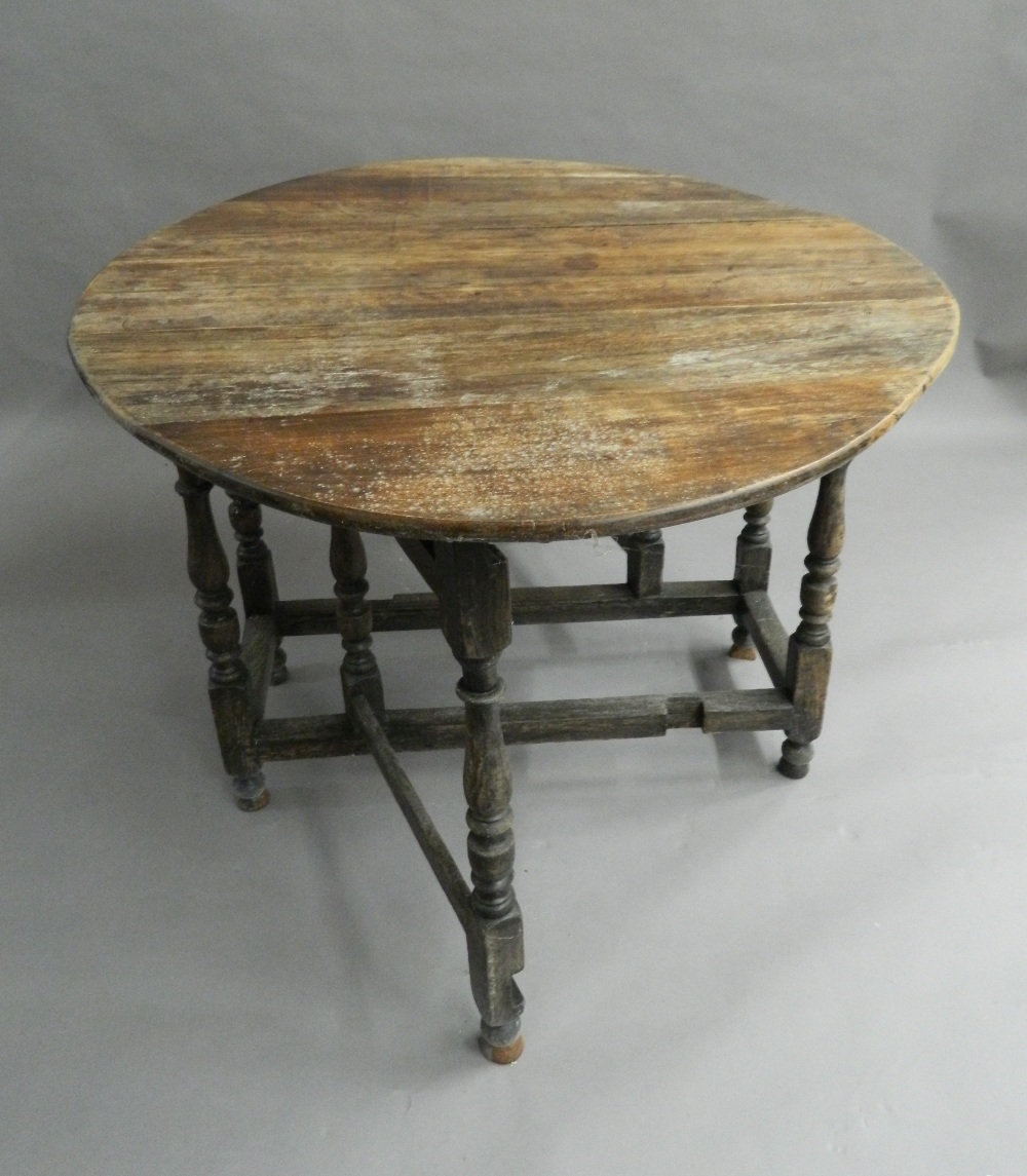 An 18th century style drop-leaf table. 101 cm wide. - Image 2 of 4