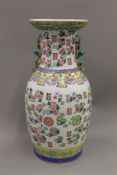 A large Chinese baluster shaped vase in the famille rose palette,