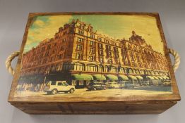 A box decorated with Harrods. 55 cm wide.