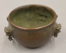 A Chinese bronze censer with chains. 10.5 cm diameter.