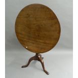 A George III mahogany tilt-top tripod table. 89 cm diameter.