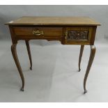 An Edwardian mahogany lady's writing table. 76 cm wide.