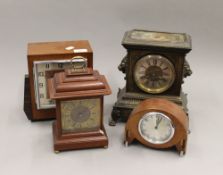 Four various mantle clocks. The largest 27 cm high.