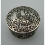 An Eastern silver box. 5.75 cm diameter (45.6 grammes).