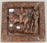 An Eastern hardwood carving of a man and cow. 35 cm wide.