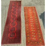 A red ground Persian wood runner and another. 254 x 80 cm and 321 x 85 cm.