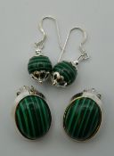 Two pairs of silver and malachite earrings. The largest 2 cm high.