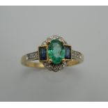 An Art Deco style 9 ct gold emerald, sapphire and diamond ring. Ring Size N/O.