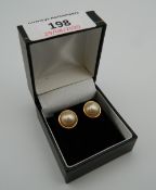 A pair of 9 ct gold and marble pearl earrings. 1.