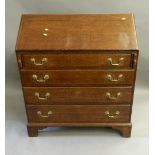 A George III oak bureau. 94 cm wide.