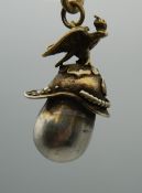 A Russian silver eagle and helmet pendant. 4 cm high.