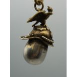 A Russian silver eagle and helmet pendant. 4 cm high.