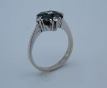 An 18 ct white gold ring with four Australian sapphires,