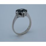 An 18 ct white gold ring with four Australian sapphires,